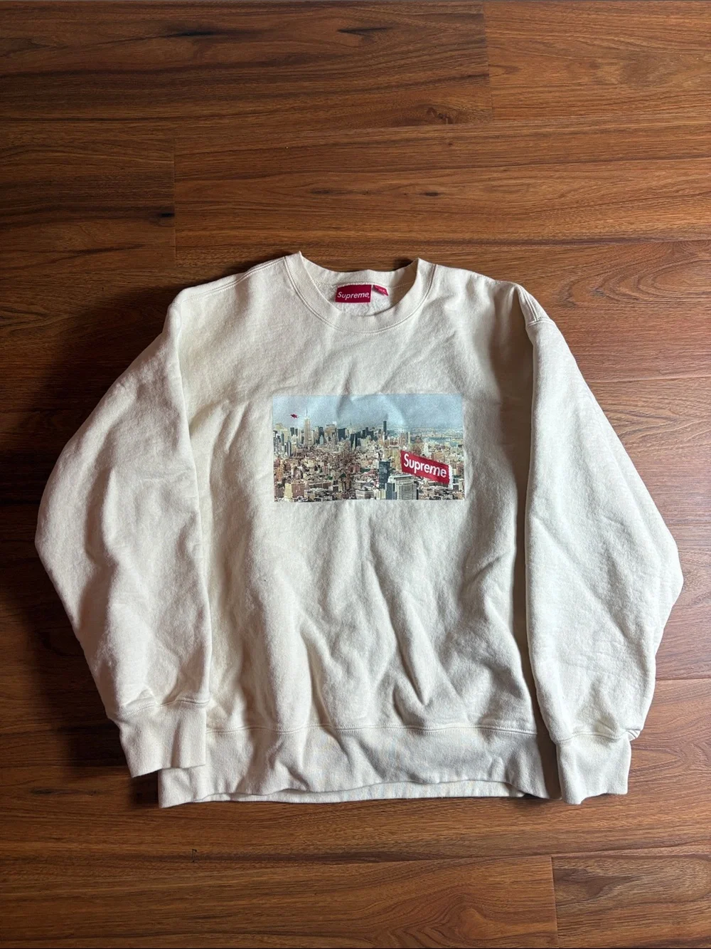 Supreme men’s large cream aerial Crewneck with Cityscape Chest Graphic